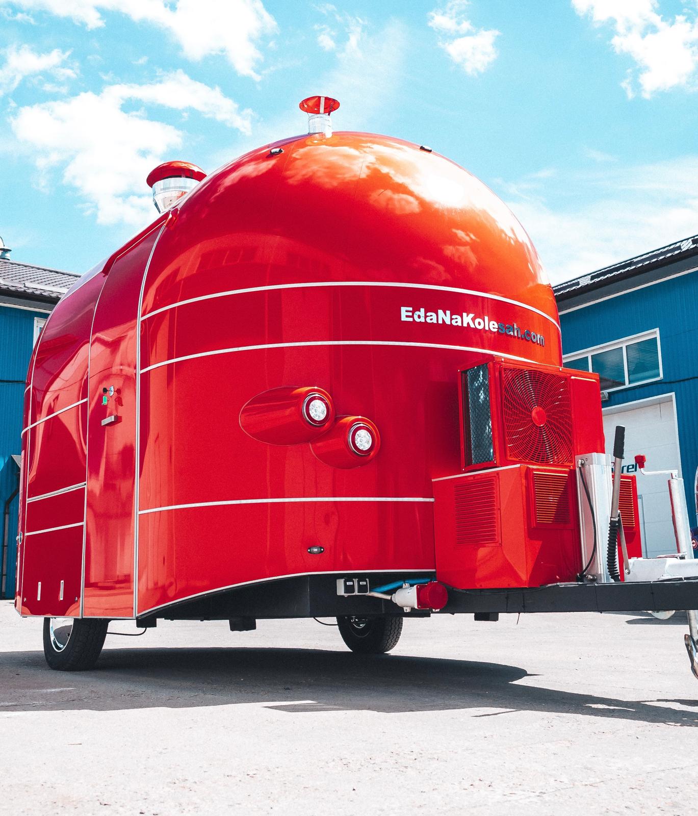 Red MobiAir commercial trailer viewed from the rear under a blue sky
