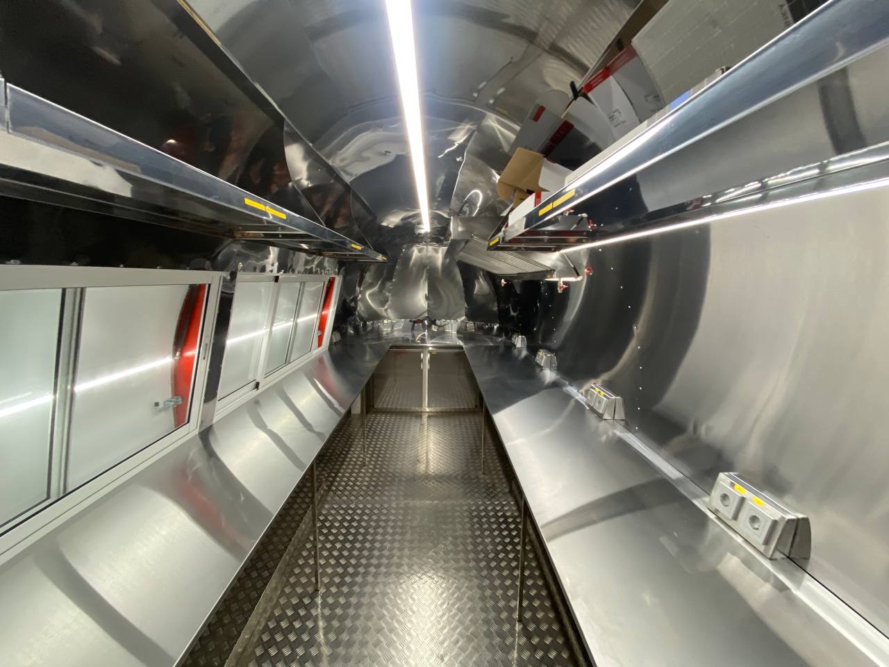 Stainless commercial interior of the completed red MobiAir trailer