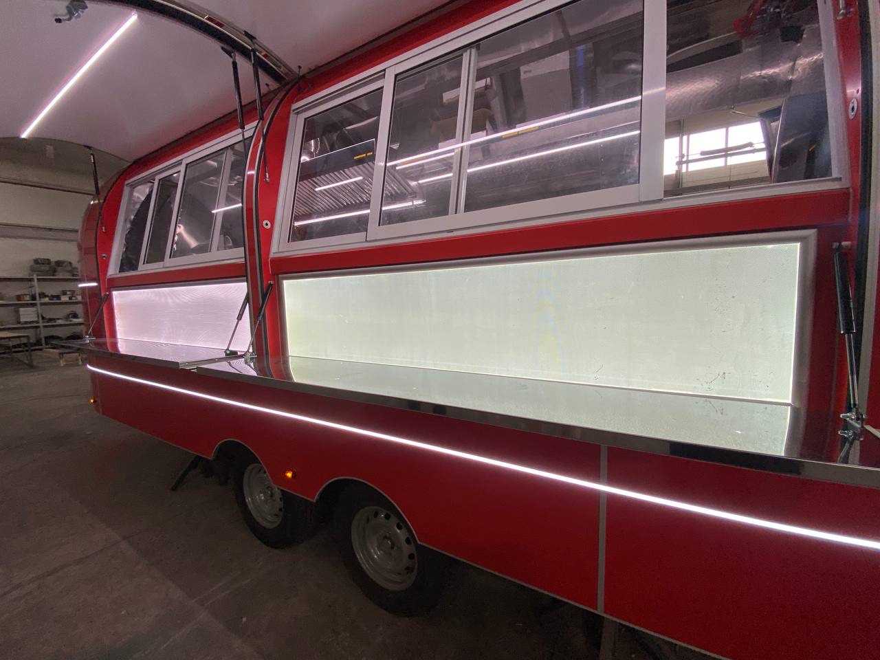 Two open service windows on the completed red MobiAir trailer