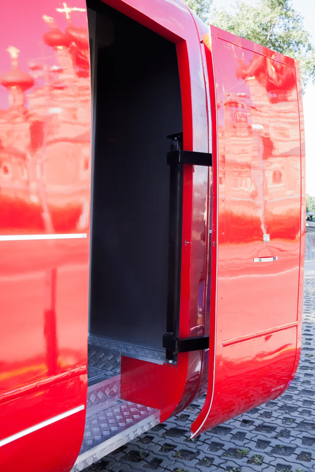 Open staff entry door and steps on the red MobiEdge 8 trailer