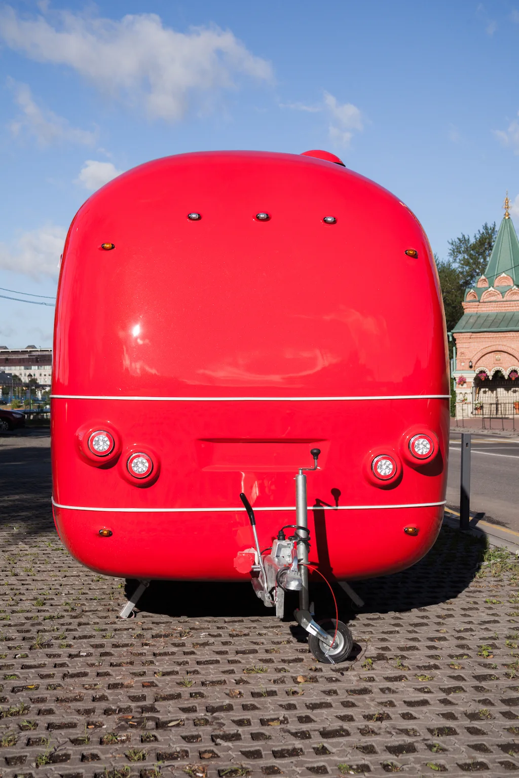Front view of the red MobiEdge 8 trailer with rounded shell and hitch
