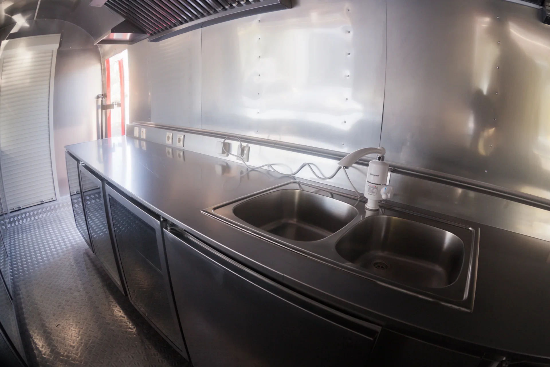 Stainless-steel double sink and counter inside the MobiEdge 8