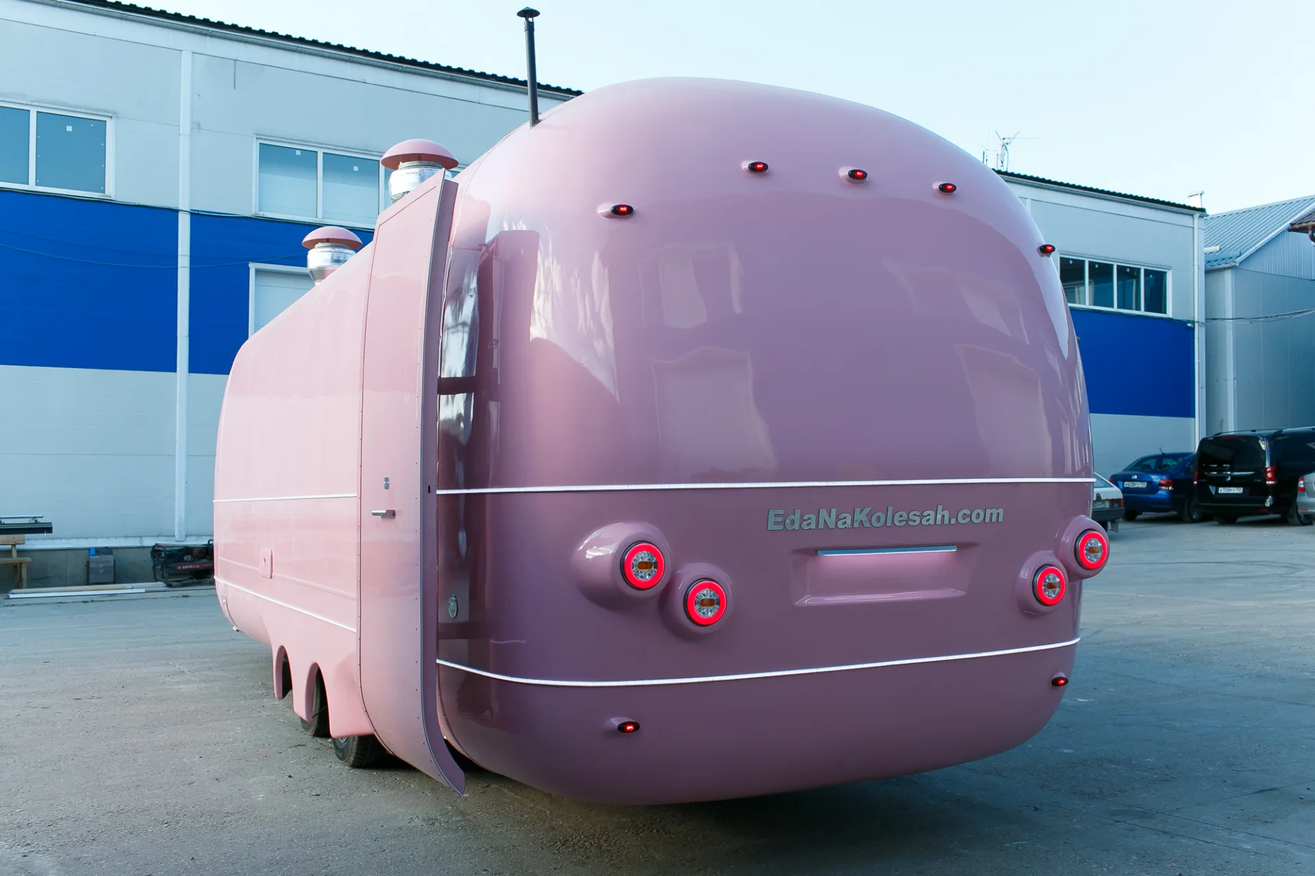 Rear view of a pink MobiEdge 8VT trailer with illuminated round tail lights