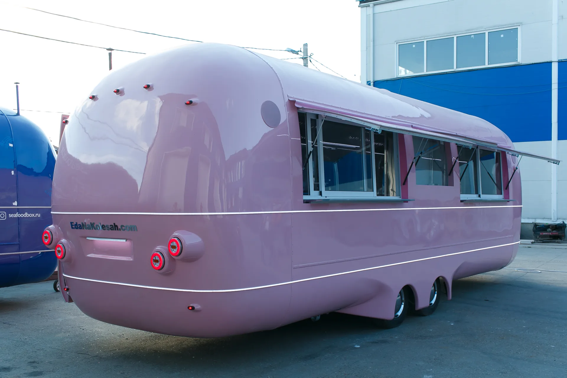 Pink MobiEdge 8VT trailer with multiple customer service windows open