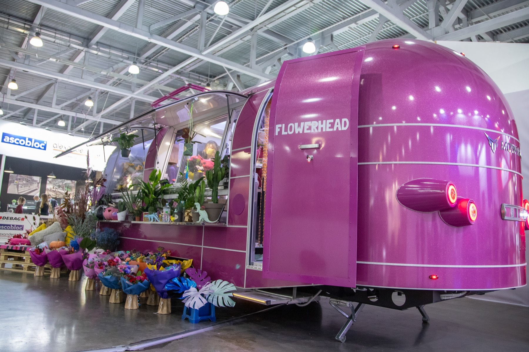 Rear three-quarter view of the Flowerhead mobile flower shop with illuminated trim