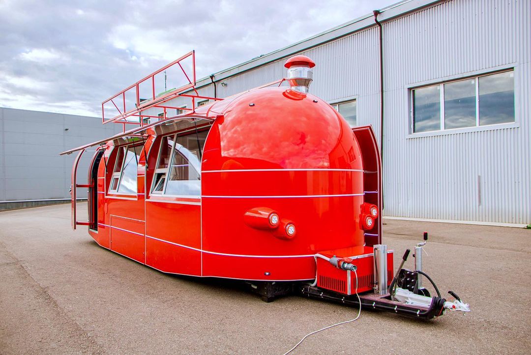 Red MobiAir food trailer with wheels and open service windows shown as a plan-review photo example