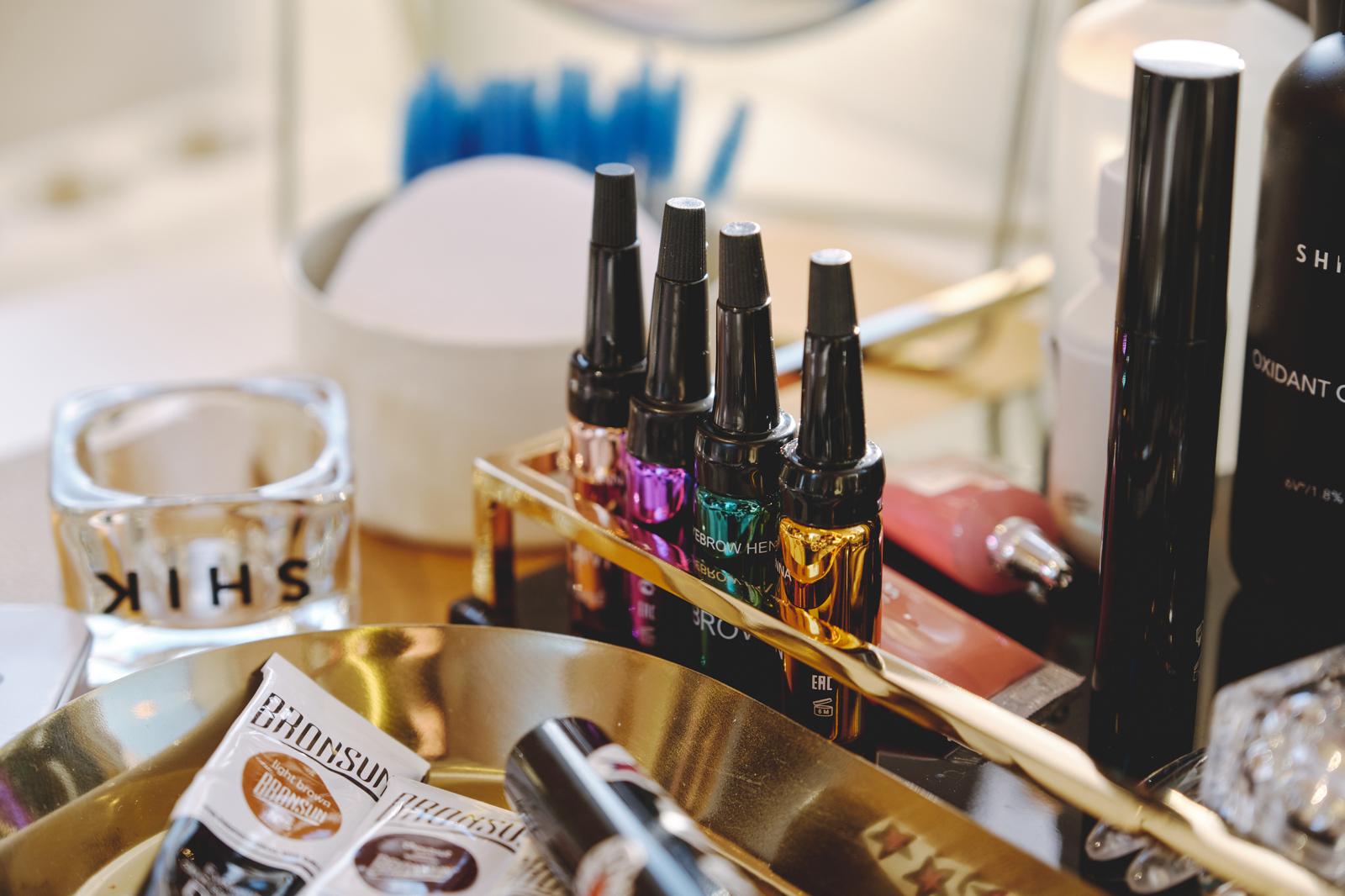 Professional brow and beauty products organized inside the MobiBeauty studio