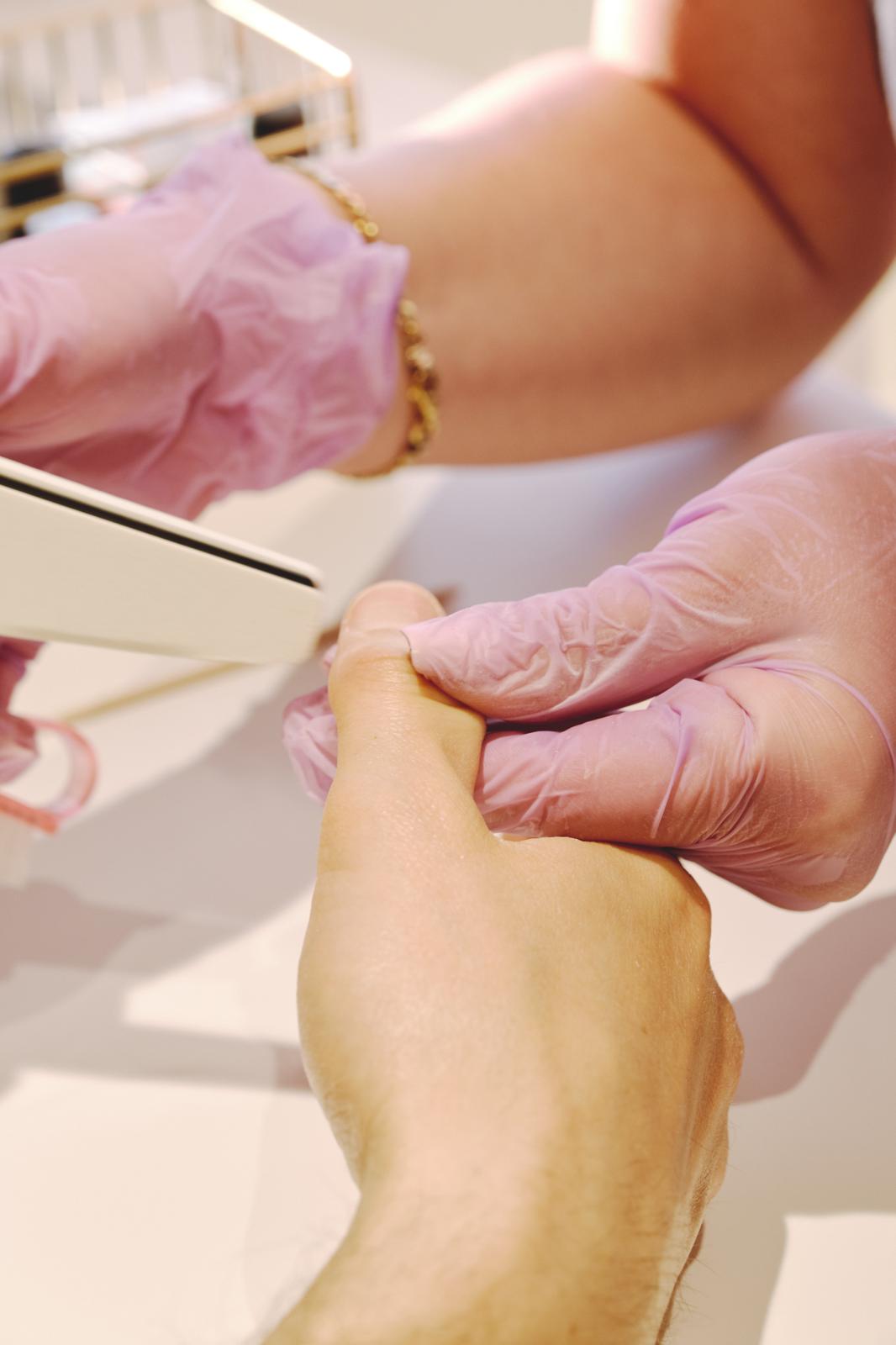 Close view of a nail treatment performed inside the mobile beauty studio