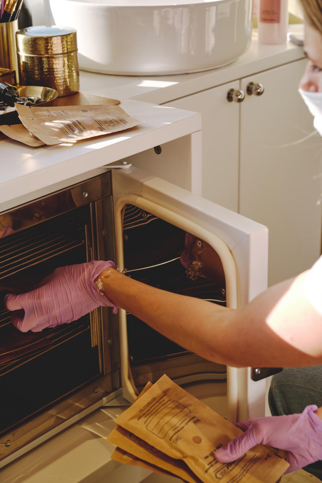 Technician using integrated sanitation and storage equipment inside MobiBeauty